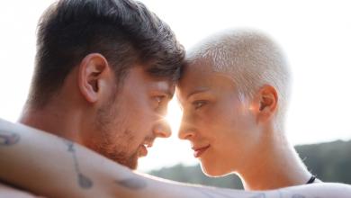 
		Young couple look deep into each other's eyes
	